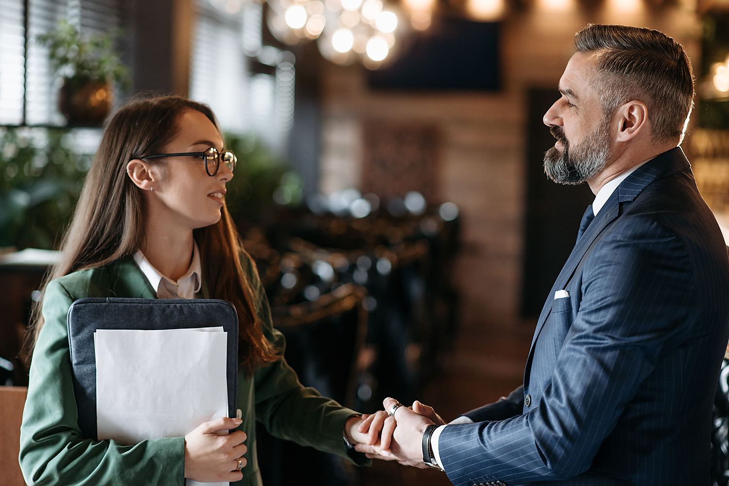 A handshake at the end of a client meeting